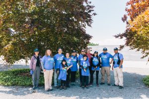 I Love My Park Day volunteers gather in front of the Copper Beech trees at FDR Four Freedoms State Park.